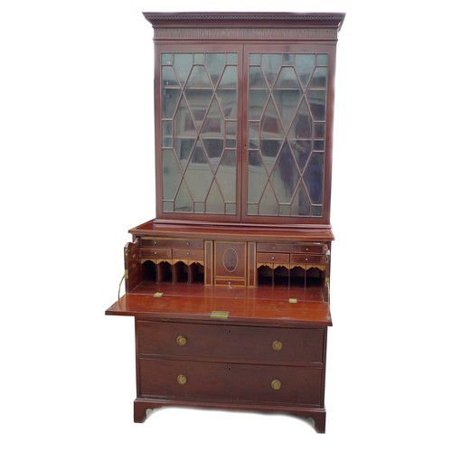 330 - A George III mahogany secretaire bookcase, the twin astragal glazed doors enclosing three shelves, t... 