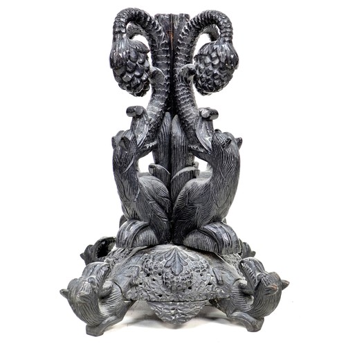 334 - An unusual 19th century carved oak pedestal table base, carved in sections with inverted beasts and ... 