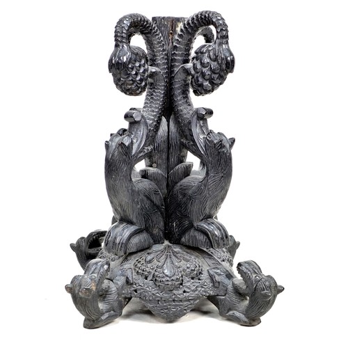 334 - An unusual 19th century carved oak pedestal table base, carved in sections with inverted beasts and ... 