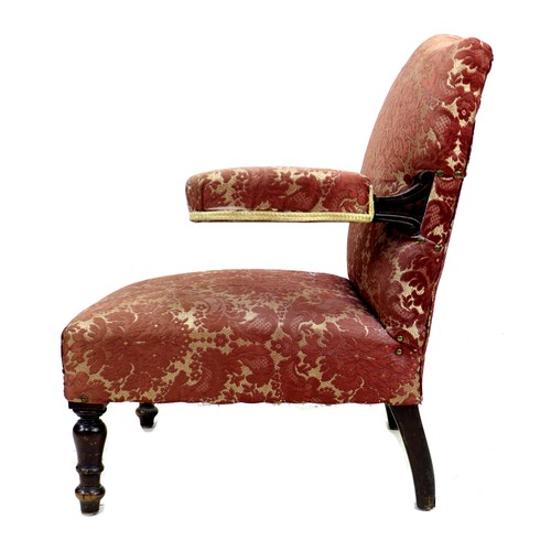 260 - A Victorian open armchair, with cantilever style padded arms, upholstered in pink foliate fabric, 68... 