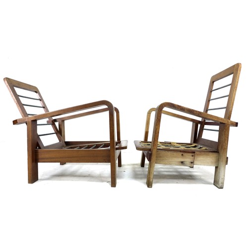 239 - A pair of African mahogany reclining armchairs, mid 20th century, with shaped bentwood arms and spru... 