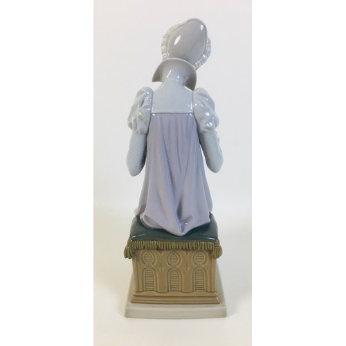 31 - A Lladro 'Seamstress' figurine, 11 by 14.5 by 28.5cm high.