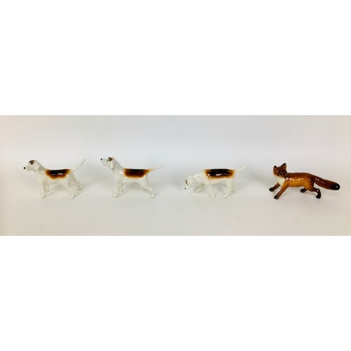38 - A group of Beswick fox hunting figurines, comprising huntsmen seated upon a horse, 23 by 8 by 21cm h... 