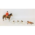 A group of Beswick fox hunting figurines, comprising huntsmen seated upon a horse, 23 by 8 by 21cm h... 