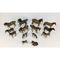 A group of fourteen Beswick horses, including two mares with raised forelegs, one with repair to ear... 