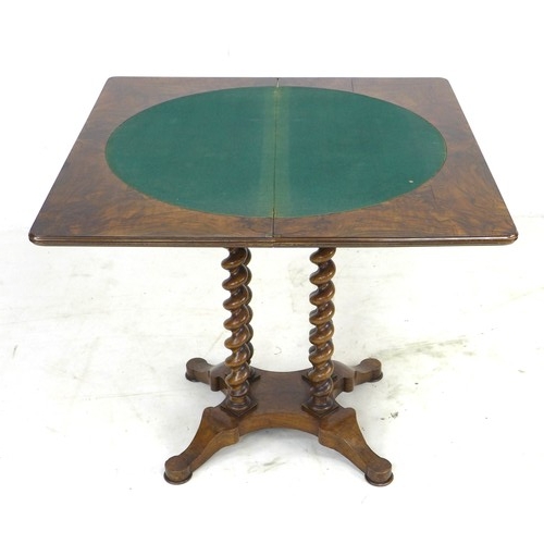 303 - A 19th century burr walnut veneered card table, fold over surface with green baize, raised on four s... 