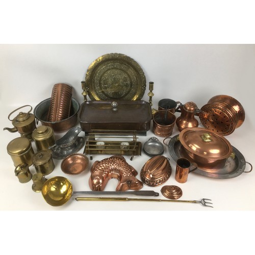 74 - A collection of copper, brass, and metal wares, including fish form jelly mould, brass ladle, lidded... 