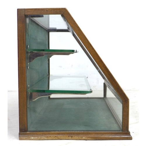 263 - A glazed table top shop display case, early 20th century, mahogany frame with sloped glazed front an... 