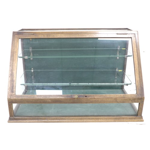 263 - A glazed table top shop display case, early 20th century, mahogany frame with sloped glazed front an... 