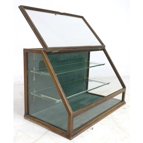 263 - A glazed table top shop display case, early 20th century, mahogany frame with sloped glazed front an... 