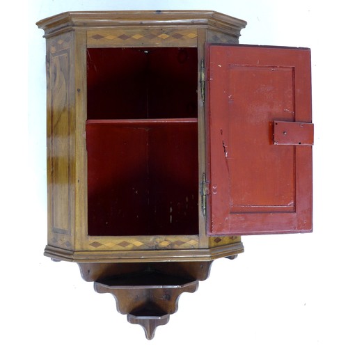 327 - A Continental early 19th century mahogany corner cupboard, single flat fronted door to canted sides ... 