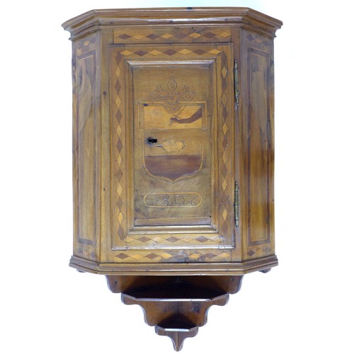 327 - A Continental early 19th century mahogany corner cupboard, single flat fronted door to canted sides ... 