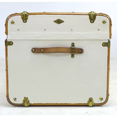 203 - An early 20th century travelling trunk, white painted canvas and wooden bound, leather carrying hand... 