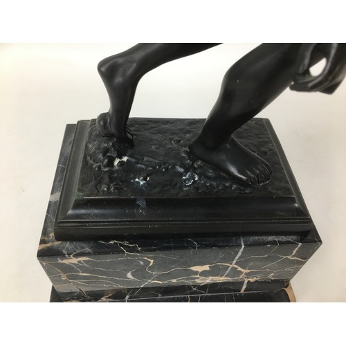 97 - After the Antique: a bronze figural sculpture, modelled as a discus thrower, on stepped marble base ... 