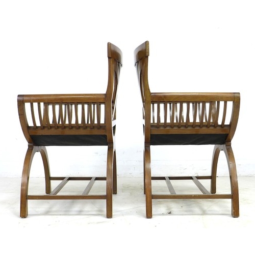 316 - A pair of Biedermeier mahogany armchairs, with stylised wheatsheaf splats, bowed seats, slatted side... 