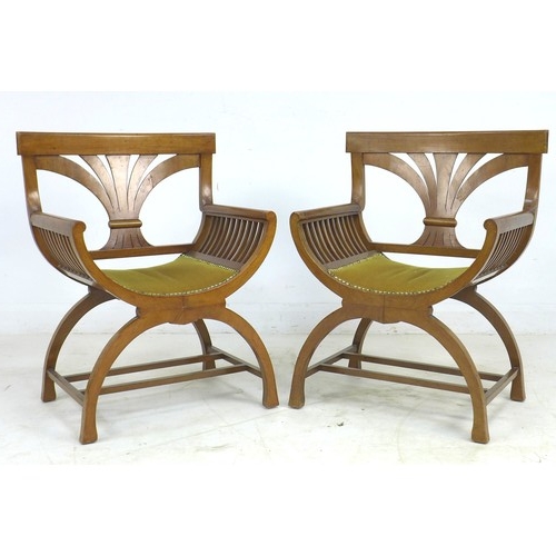 316 - A pair of Biedermeier mahogany armchairs, with stylised wheatsheaf splats, bowed seats, slatted side... 