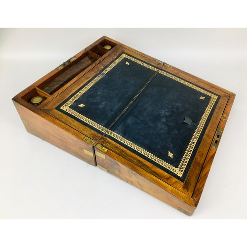 108 - A 19th century walnut writing slope, with fittings and key, its interior with original glass brass t... 