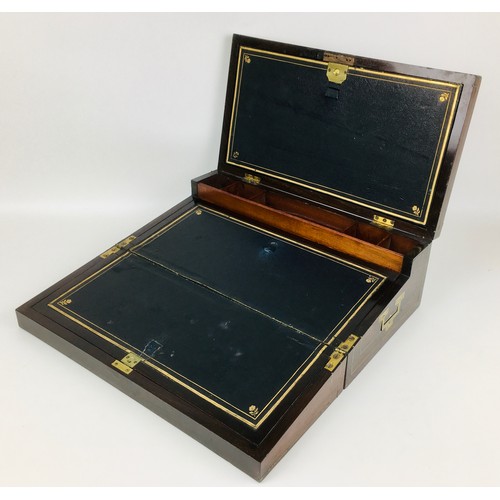 109 - A 19th century mahogany writing slope, with brass fittings including side campaign style handles and... 