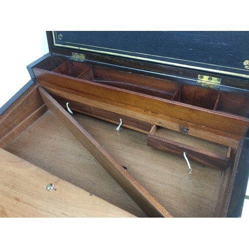 109 - A 19th century mahogany writing slope, with brass fittings including side campaign style handles and... 