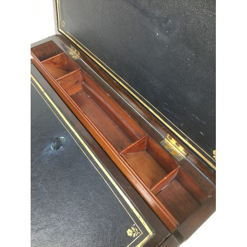 109 - A 19th century mahogany writing slope, with brass fittings including side campaign style handles and... 