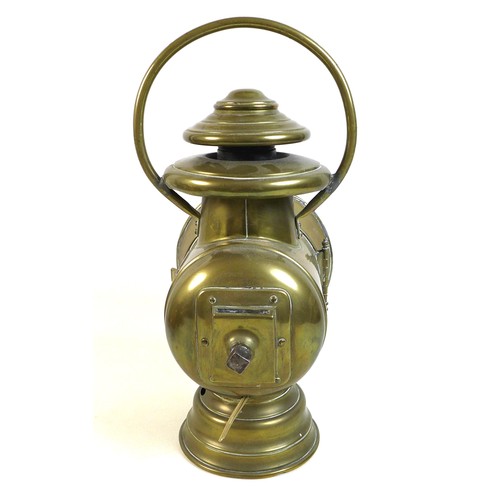 77 - A French early 20th century brass lantern motoring headlamp, later converted to an electric table la... 