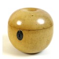 An early 19th century turned fruitwood tea caddy in the form of an apple, a/f missing stalk finial, ... 