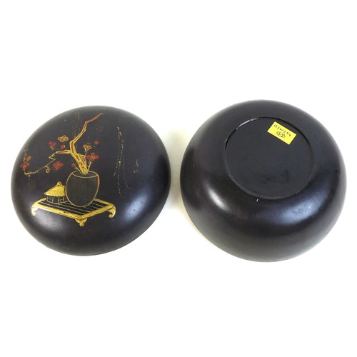 110 - A Japanese black lacquer box and cover, late Meiji period, of compressed spherical form, the lid dec... 