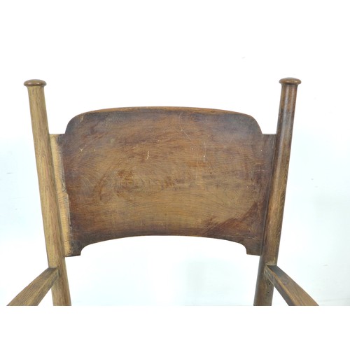 264 - An Arts and Crafts oak open arm nursing chair, of Glasgow School influence, with rush seat and curve... 