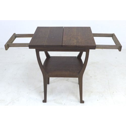 225 - An Edwardian Arts & Crafts oak side table, 49 by 62.5 by 82.5cm high.