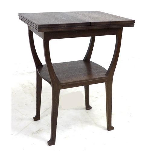 225 - An Edwardian Arts & Crafts oak side table, 49 by 62.5 by 82.5cm high.