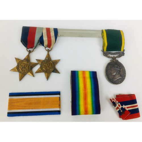 128 - A collection of militaria, comprising a WWII medal group France and Germany Star, 1939-1945 Star, am... 