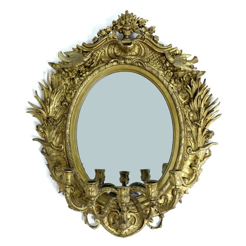 331 - A Victorian gilt girandole mirror, cast and applied oval composition frame decorated with two birds ... 