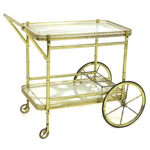 226 - A vintage Italian bamboo effect cocktail drinks trolley, with two glass shelves, pierced galleries, ... 