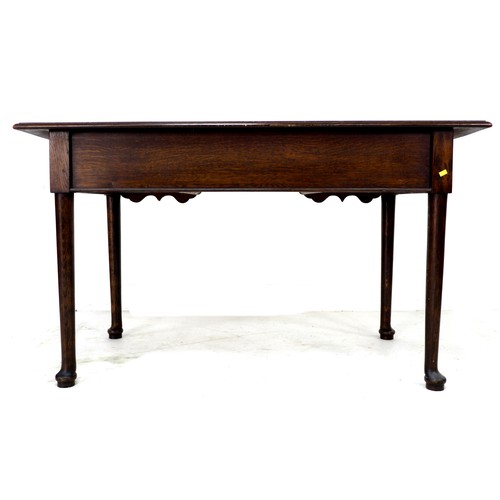 252 - An early 20th century oak side table, with three frieze drawers, brass drop handles, raised on cabri... 