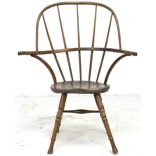 298 - An unusual 18th century and later elm and oak Windsor armchair, with open bowed arm rest, five stick... 