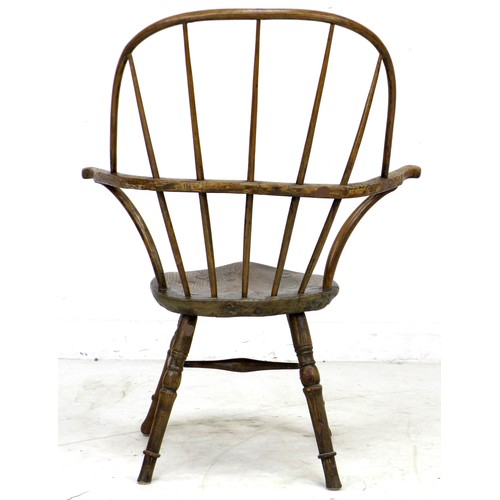 298 - An unusual 18th century and later elm and oak Windsor armchair, with open bowed arm rest, five stick... 