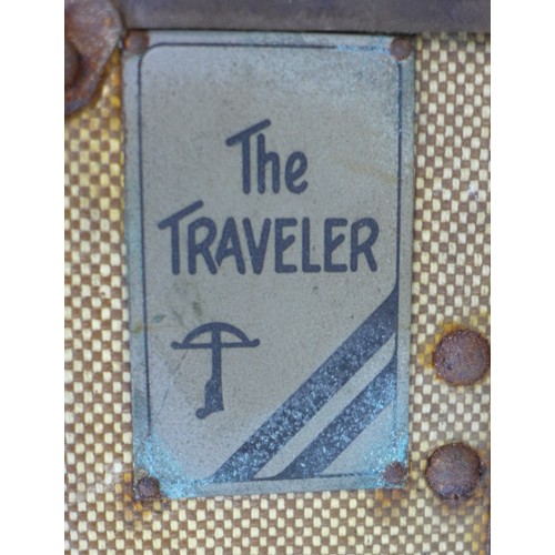 202 - Two vintage travelling trunks, canvas covered and leather bound, one labelled 'The Traveller', 80 by... 