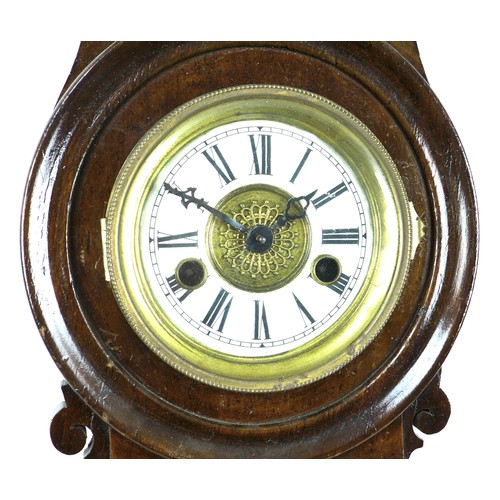 283 - A 19th century mahogany wall clock, with narrow case, and brass crest to domed top, with pendulum an... 