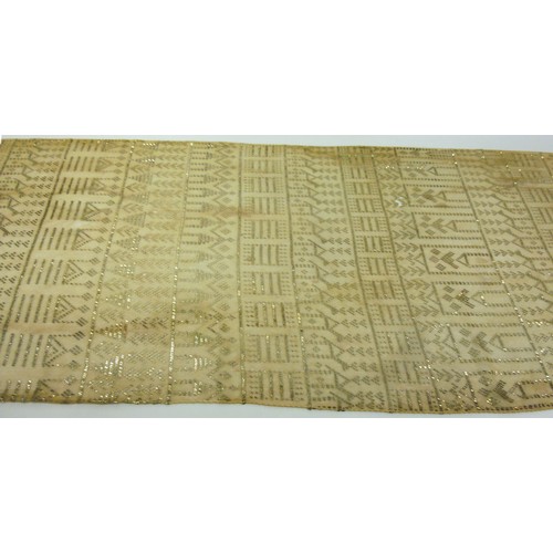 146 - A vintage Egyptian Assuit shawl, circa 1930, the cream net ground decorated with stylised figures an... 