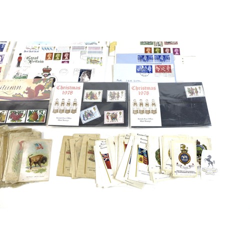 143 - A collection of First Day Covers, presentation packs and cigarette cards, the First Day Covers datin... 