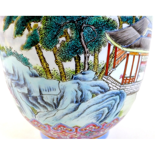 1 - A Chinese famille rose porcelain vase, mid 20th century, decorated with a continuous scene of buildi... 