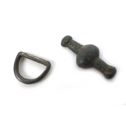103 - A group of six Medieval and later detectorist finds, comprising a strap fitting, of subovate central... 