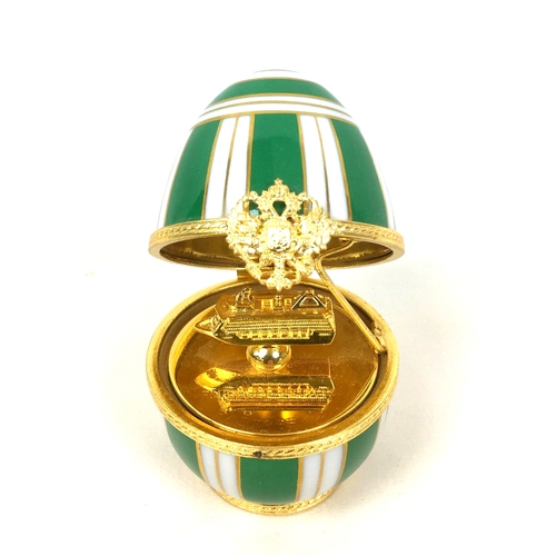 112 - A limited edition Faberge Emerald Princess Surprise egg by Limoges, with hand painted decoration, wi... 