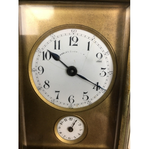 114 - An early 20th century Charles Such & Co. carriage clock with alarm, an enamel Arabic dial with subsi... 