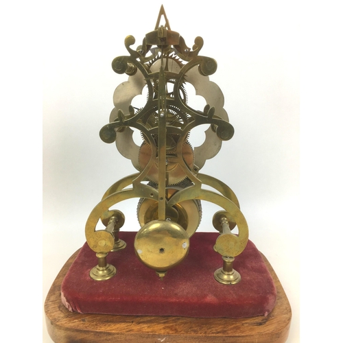 115 - A 19th century skeleton clock with fusee movement, Roman numeral dial, fixed to velvet covered base ... 