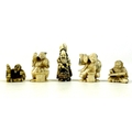 A group of five Japanese ivory katabori netsuke, late 19th and early 20th century, comprising a vend... 