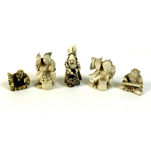 12 - A group of five Japanese ivory katabori netsuke, late 19th and early 20th century, comprising a vend... 