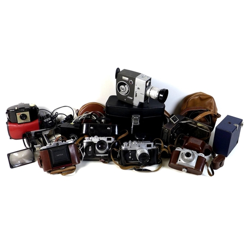 121 - A large quantity of cameras and optical equipment, including a Lumicon cine camera, Zeiss, Zorky, Ag... 