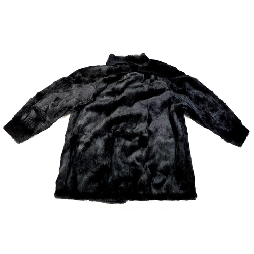 156 - A vintage East German black fur jacket, possibly originally labelled for chinchilla, complete with l... 