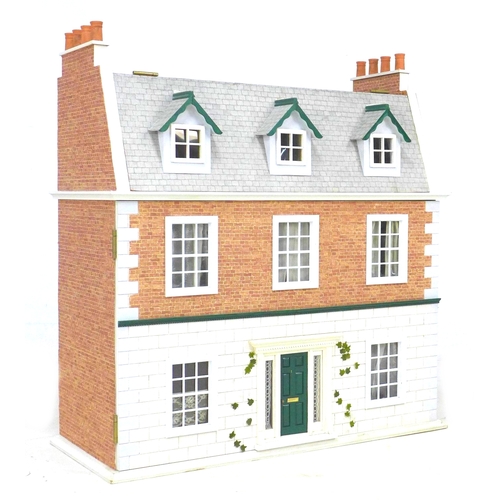 166 - A late 20th century town house style dolls house with basement and dolls house furniture accessories... 